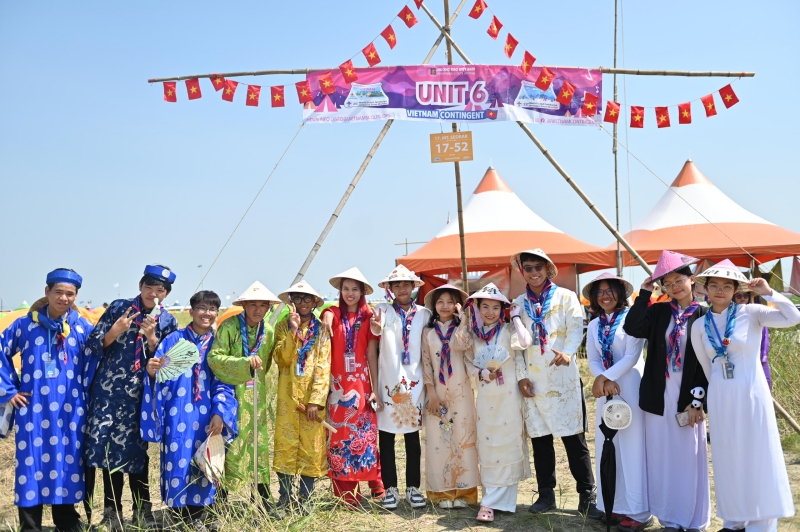 Scouts from Vietnam on Aug. 6 pose for a photo in their traditional costume ao dai at a Cultural Exchange Day event on the sidelines of the 25th World Scout Jamboree in Saemangeum. The day featured scouts learning about other cultures while roaming around the campground wearing the traditional costumes of their respective countries. 