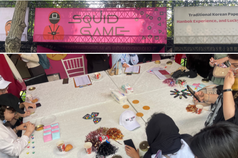 Participants enjoy traditional Korean games at the Squid Game Experience Booth durng the event.