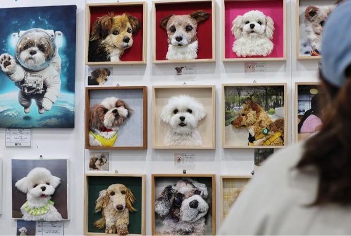 Embroidered portraits of rescued dogs