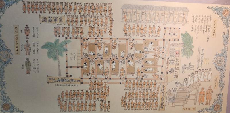 A drawing at the War and Women's Human Rights Museum shows victims of sexual slavery at rooms in the center and Japanese soldiers standing in front of them to rape them. Other troops line up in front of the rooms waiting for their turns. On the lower right are women lined up to be tested for sexually transmitted diseases. .